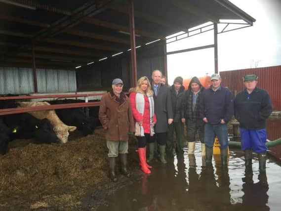 Ulster Unionist MLA Jo-Anne Dobson with colleague Alderman Arnold Hatch visiting farmers affected by flooding in the Birches area of Portadown, including members of Derrykeevan Stakeholders.