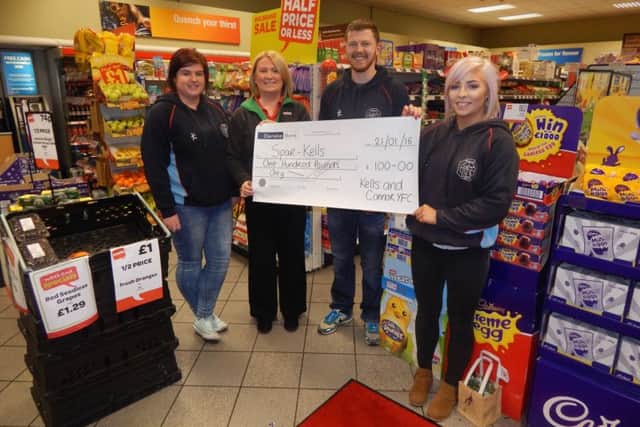 Member of Kells and Connor Young Farmers' Club make a cheque presentation