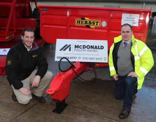 Thomas McDonald, McDonald Poultry Houses, with Ashley Crawford from Herbst Machinery who bought the plant trailer at the Fintona Spring Farm Machinery Show