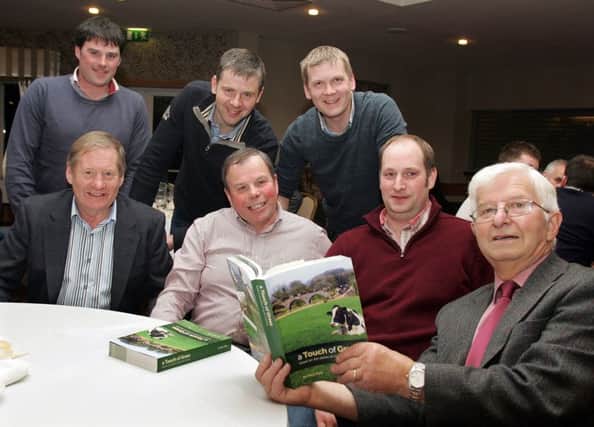 Alan Kyle (right) a retired dairy farmer from Omagh, who was guest speaker at Fermanagh Grassland Club's annual dinner and awards night, discussing his book "A Touch of Grass" with club members (front, from left) John Dunn, Brookeborough; Leslie O'Malley, Brookeborough; Edward Bruce, Ballinamallard (back row) Gary Wilson, Derrylin; David Foster, Derrylin and Trevor Dunn, Brookeborough.