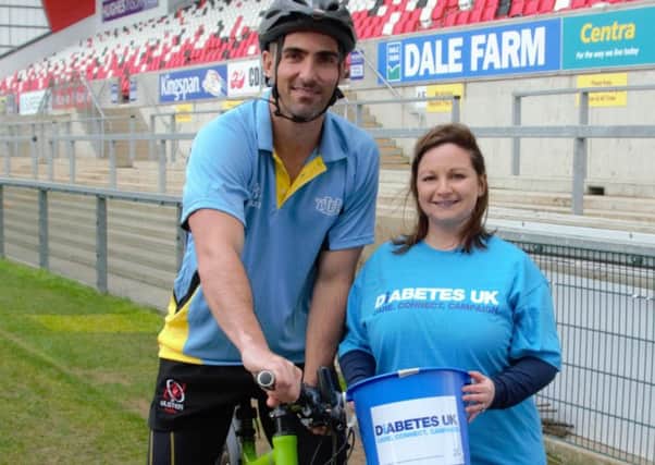 Ulster Rugbys Ruan Pienaar shows his support for the Young Farmers Clubs of Ulster 86 Miles for 86 Years charity cycle which is taking place this week throughout various towns across Northern Ireland. He is pictured with Diabetes UK Northern Ireland Regional Fundraiser, Naomi Breen.
