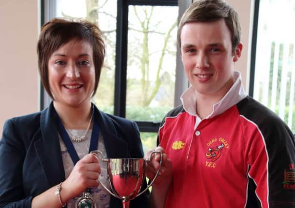 Peter Smith from Derg Valley YFC who was awarded Top Club Secretary is pictured with Roberta Simmons, YFCU President.
