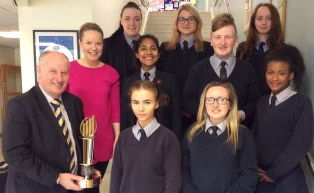 Mr Jack Dobson co-founder of Dunbia brought his EY Entrepreneur of the Year Award to St Patricks Colleges Dungannon to give the Young Enterprise Team, Enlighten Hope some entrepreneurial tips before they compete in the finals of the YE Company of the Year Award in Belfast. He is pictured with the team and Mrs Tracy Hughes, Head of Business for St Patricks College.