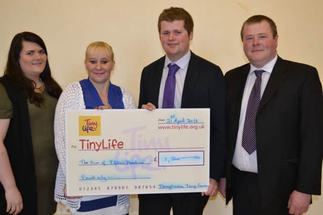 Club leader Alison with Kimberly Hill from Tiny Life, club treasurer Phil Donaldson and club president Wesley Henderson