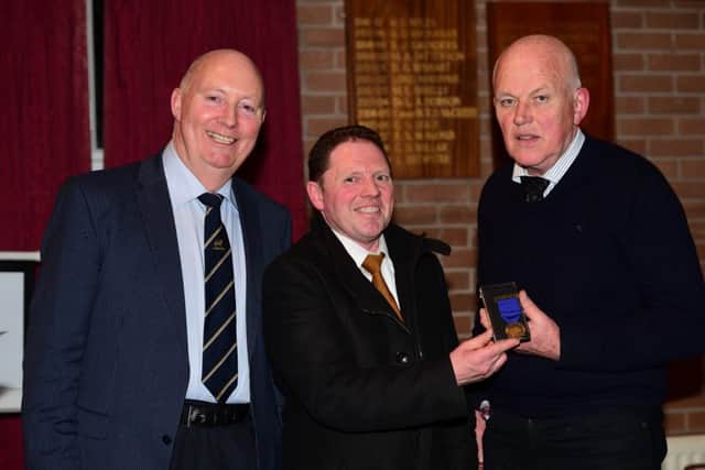 Chairman Henry Savage and NI representative Derek Frew presents Jim Quail with his honorary members medal for his years as BLCS representatives for 18 years