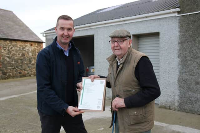 Willie Peden receiving his Sprayer Certificate from Eoin McCambridge of BNG Training.