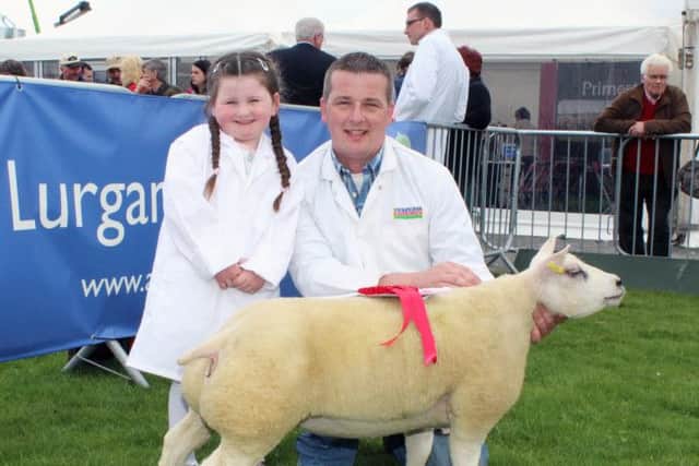 Mark Latimer and his niece, Ruby Jane Latimer of the Brownville Flock, Bessbrook with Brownville Big Mama, DWR B02 ET, Ewe Lamb class winner and Reserve Female Champion.