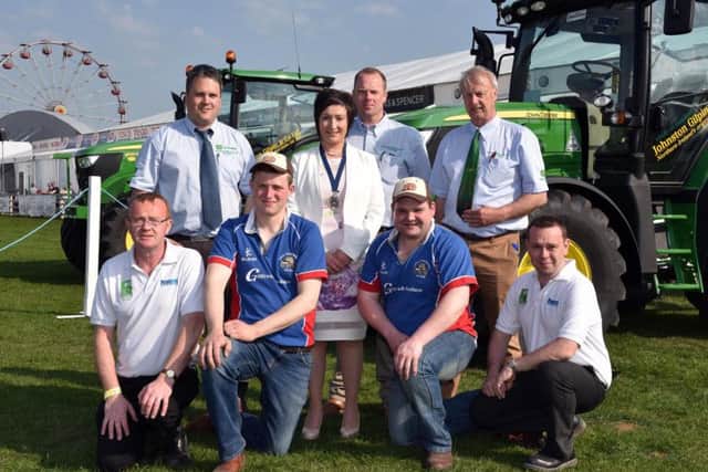 Pictured receiving their second place prize in the YFCU Machinery Handling competition are County Armagh members Benjamin Allen and Thomas Chambers from Collone YFC with YFCU President, Roberta Simmons; Gethin Jones, sponsor from Johnston Gilpin & Co and Paul Kelly, HSENI. Also pictured are representatives from Johnston Gilpin & Co and HSENI.