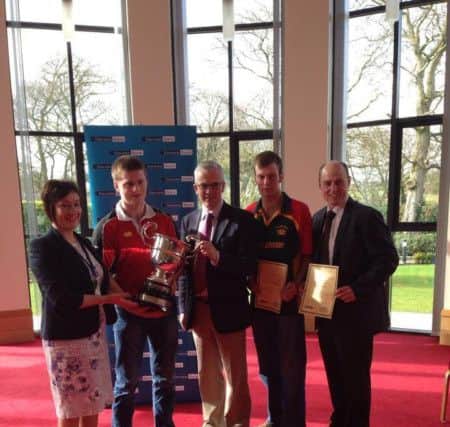 James McCay receiving his award for second place in the 'Ulster Young Farmer' competition.