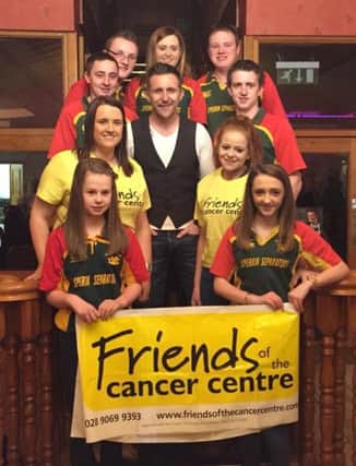 Cappagh YFC members with Johnny Brady, preparing for their upcoming barbecue.