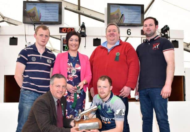 Thomas Perry from Strabane YFC is presented with his trophy from David John, from sponsor Lister Shearing for coming first in the YFCU Advanced Sheep Shearing Competition. Russell Smyth from Coleraine YFC (pictured back left) was awarded third place and Stephen Morgan from Spa YFC (pictured far right) was awarded second place. Also pictured is YFCU President Roberta Simmons and Patrick Allen from Moira Equestrian Centre who provided a cash prize for the best shorn pen of sheep, with Stephen Morgan from Spa YFC (who also came second in the advanced section) taking the prize.