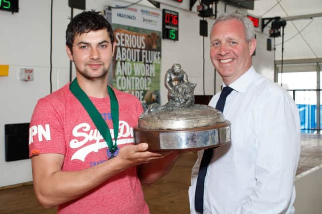 Jack Robinson, Claudy won the Zoetis sponsored Royal Ulster National Sheep Shearing Championship Final at Balmoral Show and is pictured with Raymond Irvine, Zoetis, Sponsor. Photograph: Columba O'Hare