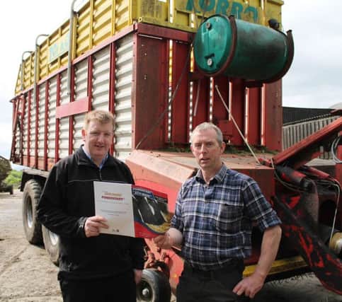 Sam Little, Dairy Farmer, Poyntzpass and Conor Loughran, Genus ABS discussing preparation for silage harvest and the benefit of using Powerstart in current challenging weather conditions