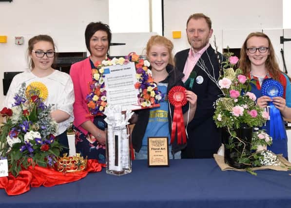 Pictured are the 12-14 age category winners in the YFCU Floral Art Competition. From left-right: third place winner, Emily Harris from Killinchy YFC; YFCU President Roberta Simmons; first place winner, Christina McConnell from Holestone YFC; Sean Largey,  Commercial Manager from sponsor, Tesco NI and 2nd place winner, Cara Millar from Coleraine YFC.