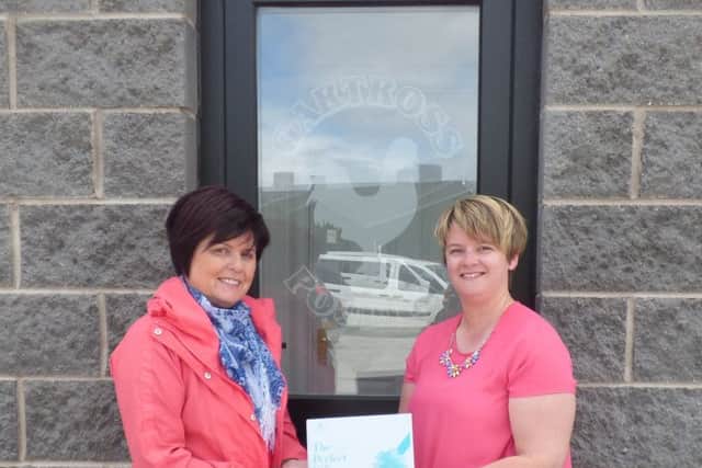 Melissa Wylie from Rural Support presenting Ruth Culbertson with her voucher for an overnight stay in the Slieve Donard Resort & Spa, Newcastle.