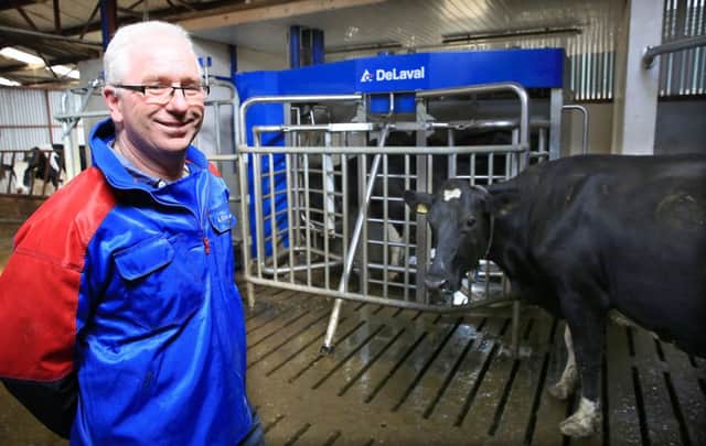Drew McConnell, in the milking area where he has installed a DeLaval Voluntary Milking System.