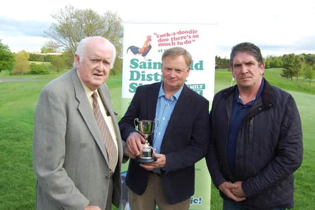 Saintfield Show committee president Derek McMillan (left) presents the Jacob Sheep Cup, to the shows Head of Sheep Section in the company of Saintfield Show chairman Brian Hunter. The cup will be presented for the first time this year