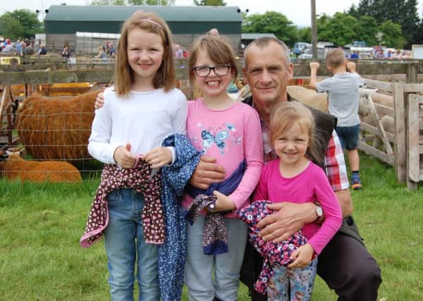 Enjoying their day out at Ballymoney Show: Gerard Kelly, from Ballycastle with granddaughters Amy, Corina and Effie Davidson, from Armoy