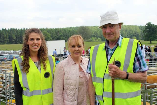 Agriculture Minister Michelle McIlveen spent the day with farmers and exhibitors at the Armagh Show on Saturday 10 June 2016. Minister McIlveen (centre) is pictured with Show Stewards Hannah Chapman (left) and Jack McGowan (right). Photo Louise Millsopp