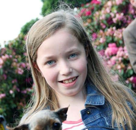 Little Eva with "Tilly" at the Antrim Agricultural Show launch look forward to the dog section class.
