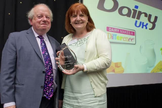 John Sergeant with Catherine Collins RD accepting her Dairy UK Award for Scientific Excellence