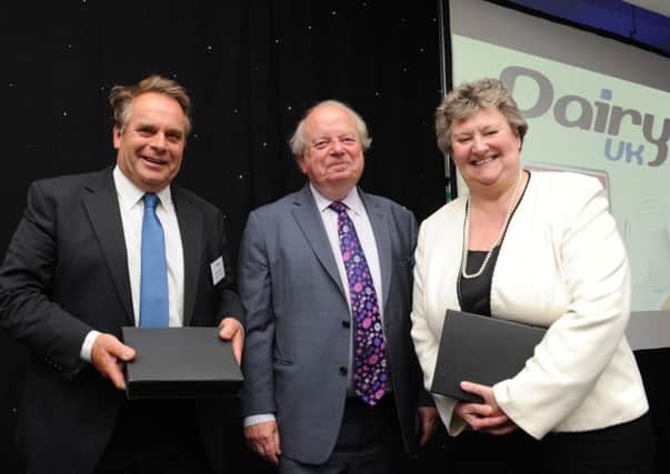 Neil Parish MP, John Sergeant and Heather Wheeler MP accepting their Dairy UK Award