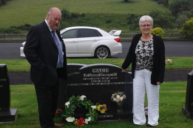 Mercer and Miriam at their son Allan's grave in Dromore