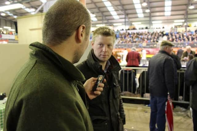 Greg Thomas (foreground) conducting the Humans of the Royal Welsh project at the 2015 Royal Welsh Winter Fair