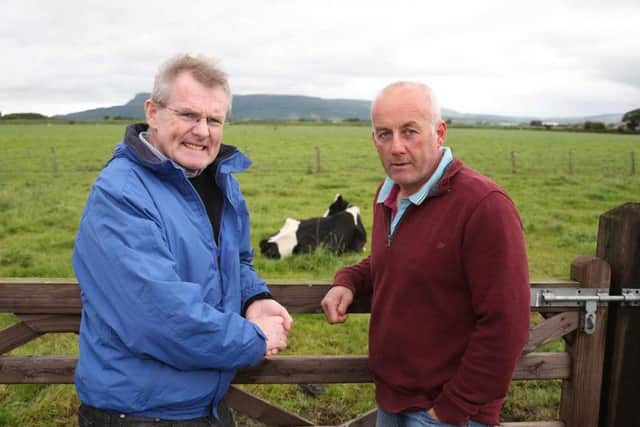 Gabriel DArcy and Robert Craig in discussion during the LacPatrick CEOs visit to the Craigs farm in Limavady.