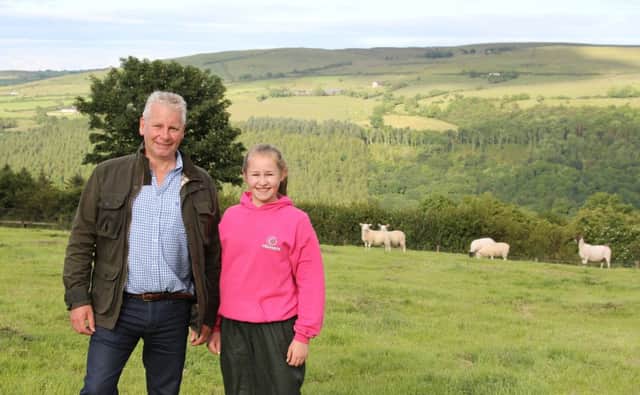Adrian Morrow with his niece Ruth overseeing their crossbred Dorset lambs