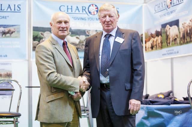 Outgoing president Cyril Miller with new British Charolais Cattle Society president Peter Donger