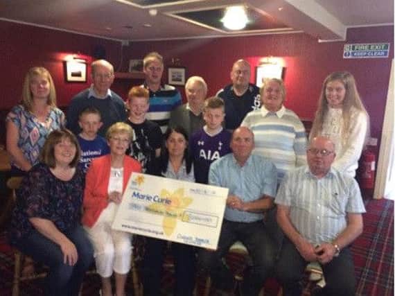 Presentation of Â£3000 cheque to Mrs Johanne King (front centre) Marie Curie along with Kathleen Burns (second from left), daughter Mrs Oonagh Flynn, Liam Quinn chairman & Liam OConnor treasurer.