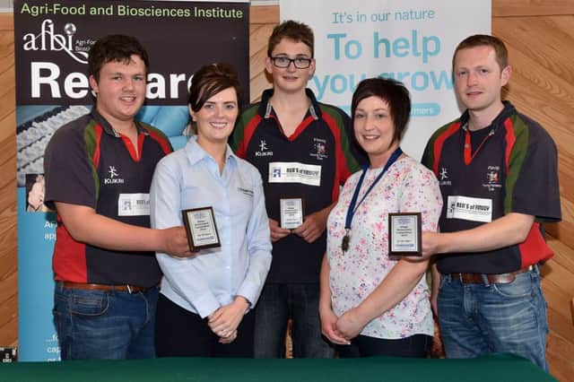 Some of the winners from the YFCU silage assessment finals. Left to right are: Philip Beattie, first in the 16-18 age category, judge Carolyn McKendry from sponsor John Thompson & Sons, Gavin Finney, first in the 14-16 age category, YFCU president Roberta Simmons and David Dunlop, first in the 25-30 age category