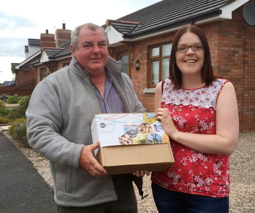 Joanne Wright from Portadown is presented with a Bank of Ireland Open Farm Weekend Food Hamper by Harry McGaffin from Blackberry Hill Farm, Gilford.
