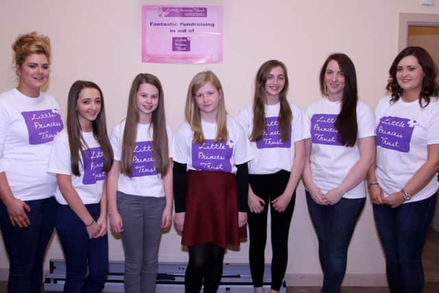The girls before getting their hair cut, pictured with hairdressers Kerry and Kelly