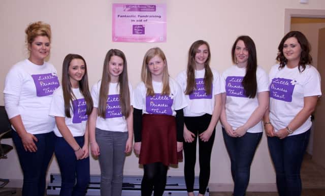 The girls before getting their hair cut, pictured with hairdressers Kerry and Kelly