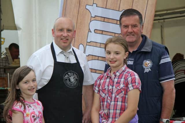 Discussing plans for the NI Simmental Club'a annual charity BBQ on 5th August, are club secretary Robin Boyd, right, with Colin and Charlie Harbinson, and Emma Knox, from The Meat Joint, Antrim.