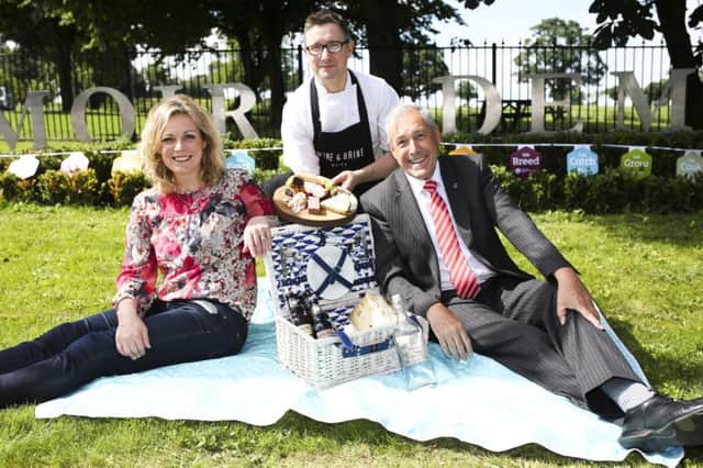 Moira-based Great British Menu Chef Chris McGowan, Wine & Brine, serves up a local picnic to Councillor Uel Mackin, Chairperson for Lisburn and Castlereagh City Council Development Committee and Event Organiser Joanne McErlain, Babble, including charcuterie and cheeses available at the upcoming Speciality Food Fair Moira, Saturday 20th August at Moira Demesne.  Organised by Lisburn and Castlereagh City Council, this years fair will see over 40 small-batch artisan producers from as close as Moira and as far as Derry gather for an afternoon of kitchen sessions led by esteemed local chefs, opportunities for customers to interact with and purchase directly from artisan producers, and outdoor areas to enjoy the best of Northern Irelands local produce and artisan goods al fresco. For more information on the many local producers confirmed for this years fair visit http://www.visitlisburncastlereagh.com/.