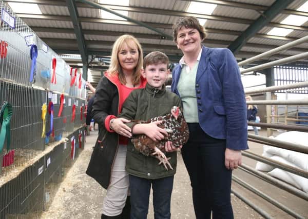 Ben Foster is photographed along with one of his hens as the First Minister Arlene Foster and Agriculture, Environment and Rural Affairs Minister Michelle McIlveen visited the Fermanagh County Show today.
The Ministers took the opportunity to meet with show organisers to congratulate them on winning the Farmers Guardian Show Business Awards for best show in the UK in 2015.  
Photographer - Â© Matt Mackey / Press Eye