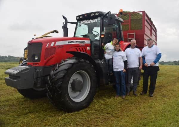 The Smith family pictured with silage volunteer Rob Graham from Banbridge who took part in the BIG Silage Fest and raised Â£200 for Alzheimers Society.
