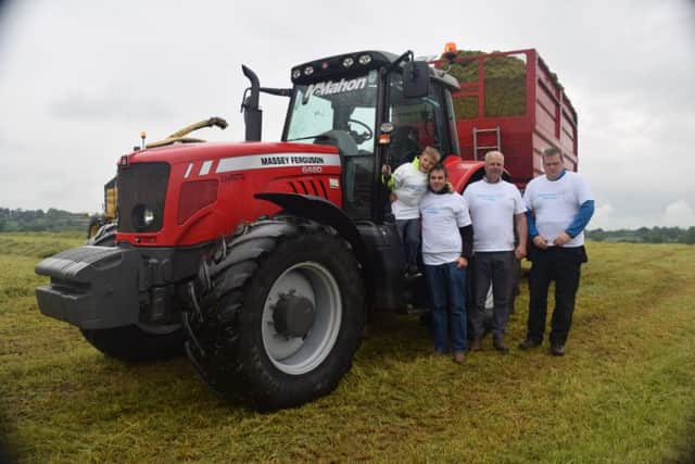 The Smith family pictured with silage volunteer Rob Graham from Banbridge who took part in the BIG Silage Fest and raised Â£200 for Alzheimers Society.