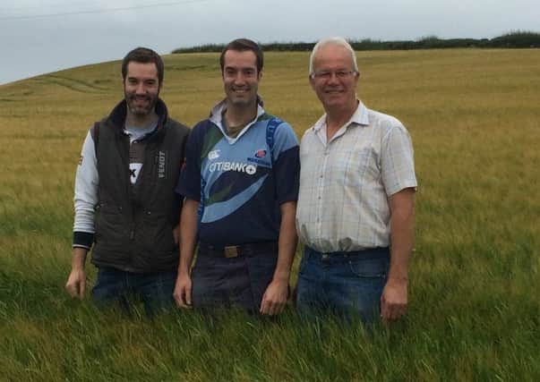 Pictured in the winning field of spring barley are William, David and Raymond Wilson.