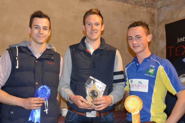 Sam McConnell, Stewart Ferris Jnr and Nathan Armstrong receiving the 1st, 2nd and 3rd prizes respectively for the 19-30 Age Group at the Stockjudging at the Templepark Texels Stockjudging Event hosted by William and James Herdman.