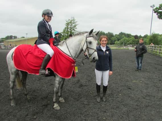 Ellen Thompson and Euros Delight winners of 138 Open with sponsor, Roisin Donnelly, RD Equestrian
