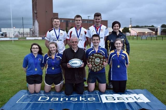 Members of Moycraig YFC with the Rosemary Cooper shield after winning the junior title at the YFCU 2016 Tag Rugby tournament at Omagh RFC. The winning team are pictured with John Henning, Head of Agri Relations Danske Bank and YFCU President Roberta Simmons.