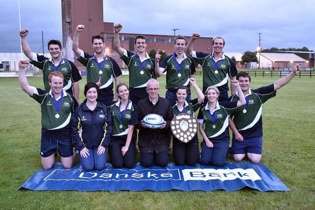 Members of Annaclone and Magherally YFC with the Adrian Cooper shield after winning the senior title at the YFCU 2016 Tag Rugby tournament at Omagh RFC. The winning team are pictured with John Henning, Head of Agri Relations Danske Bank and YFCU President Roberta Simmons.