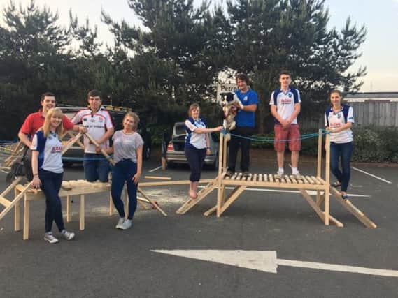 Members with their finished bridge at the Build it competition