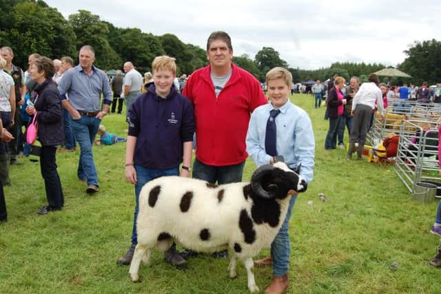 RBST Northern Ireland chairman Brian Hunter with brothers Jed and Reuben Taylor, from Tandragee.  The Taylors will be well represented with a selection of high quality pedigree Jacob Sheep at the upcoming Rare BreedsÂ’ show and sale in Gosford Park on Saturday September 3rd.