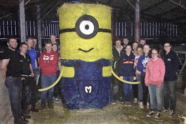 Members of Moneyrea Young Farmers' Club and Killinchy Young Farmers' Club with their bale art