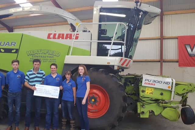 Mervyn Gordon, NE Derry group chairman presenting a cheque to Geoff McNeill, Garvagh YF Club leader, for the proceeds from the summer BBQ